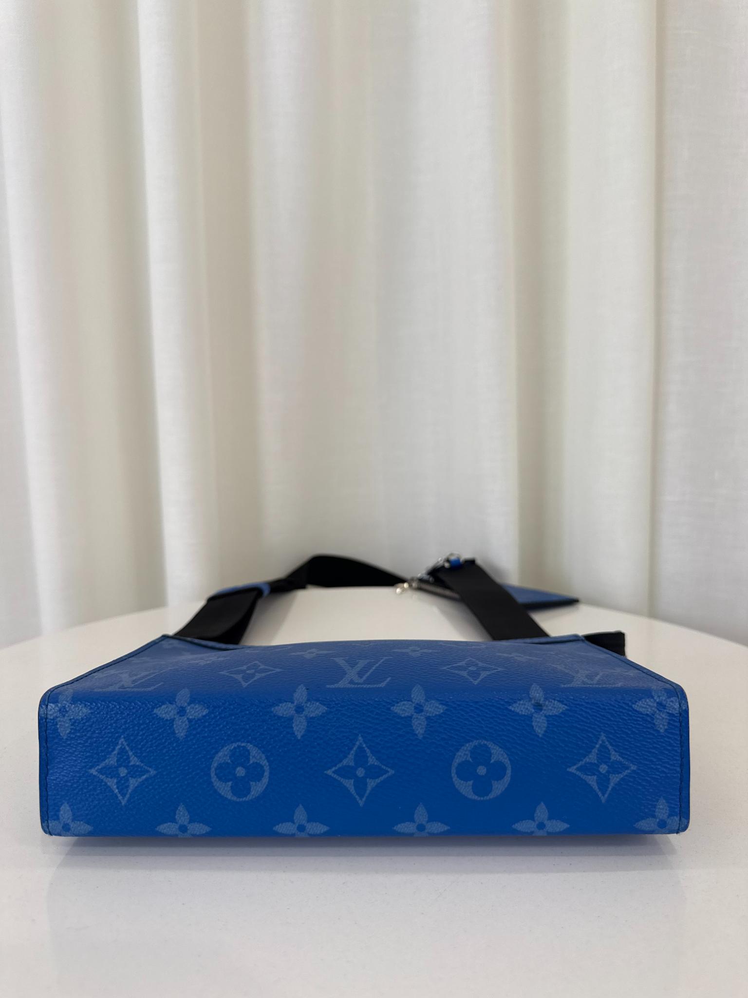Louis Vuitton Men’s Gaston Wearable Wallet Blue Monogram Taigarama