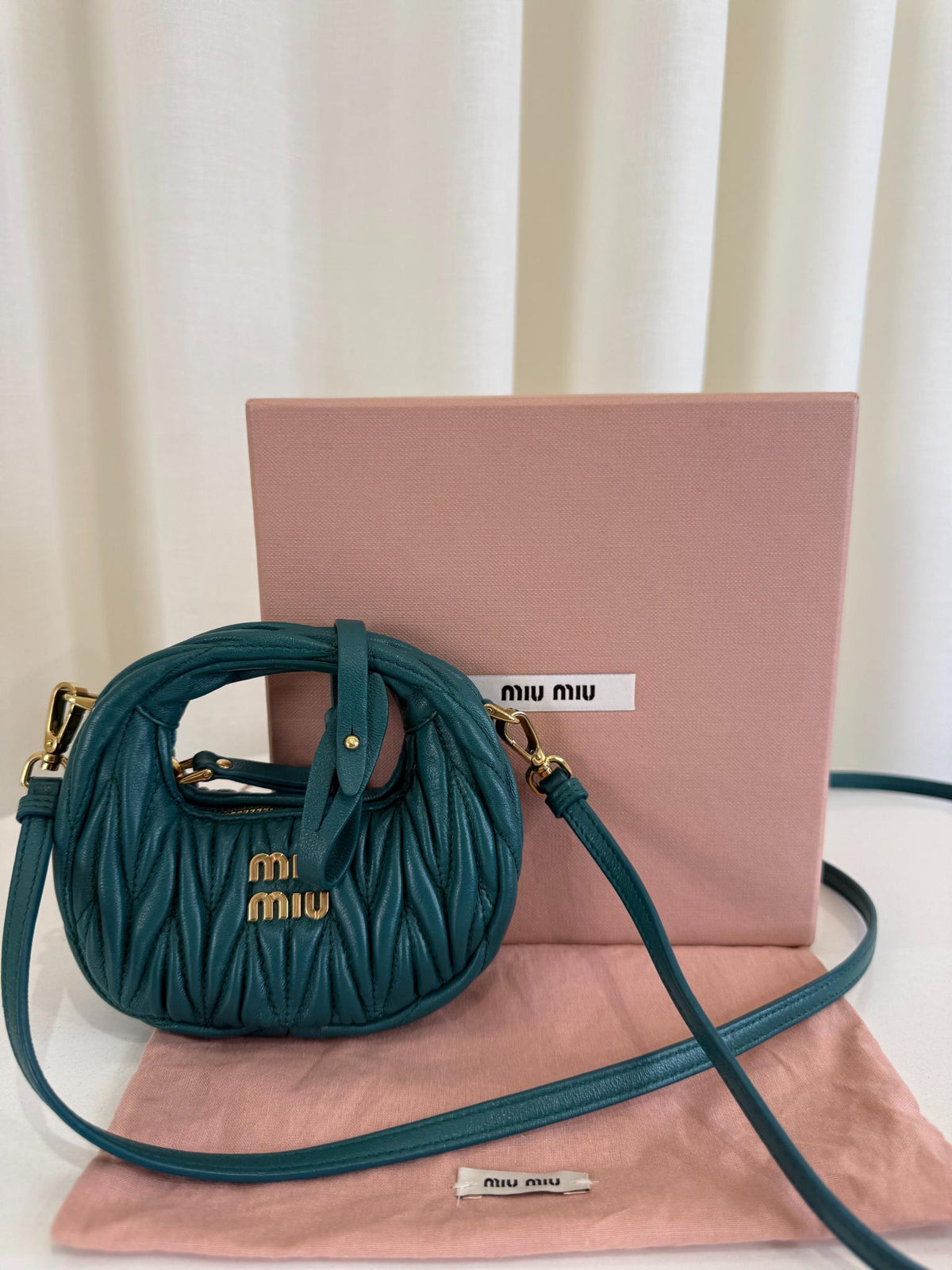 Miu Miu Wander Matelassé Nappa Leather Hobo Micro Bag Lagoon Blue