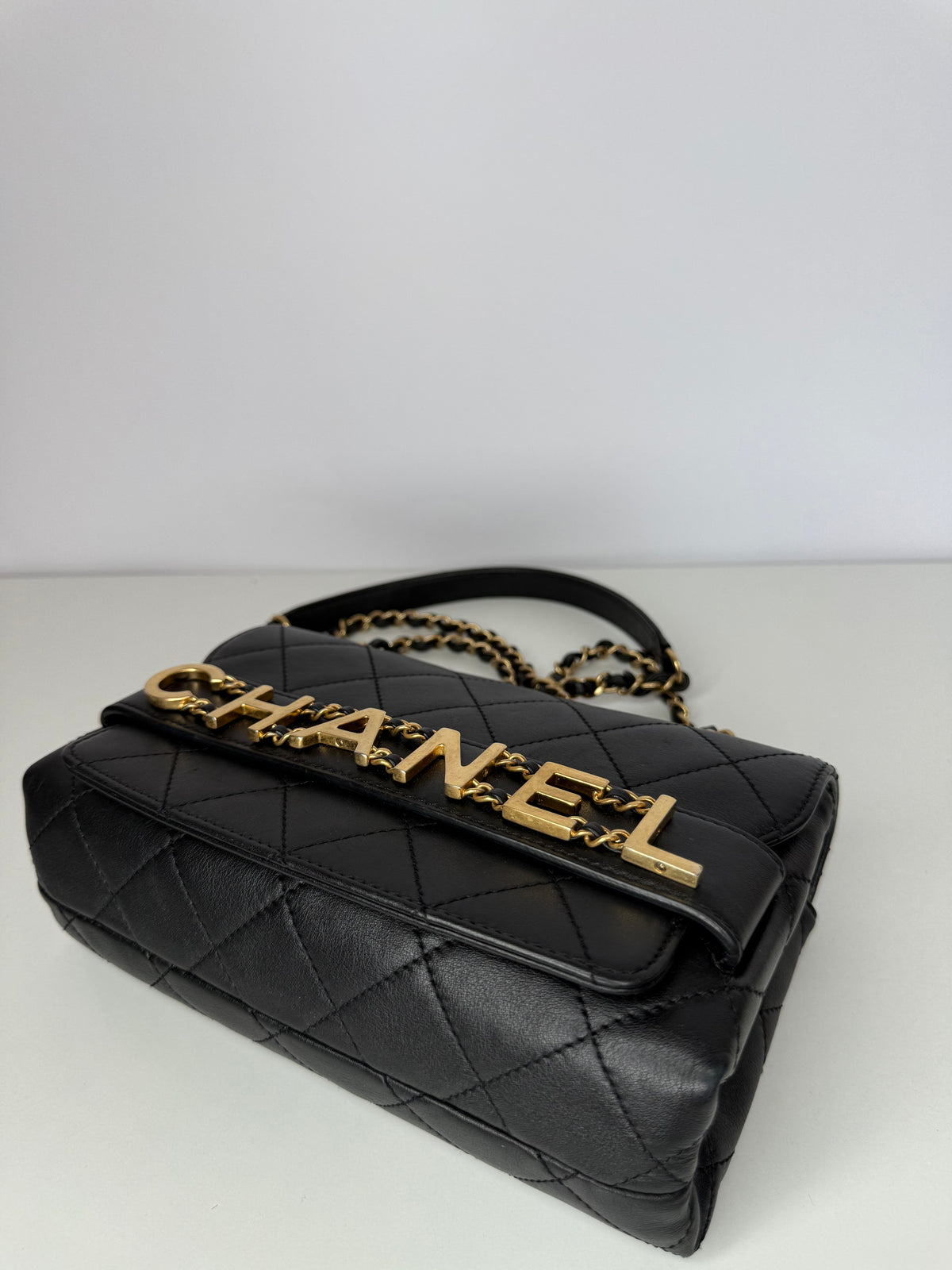 Chanel Logo Enchained Black Quilted Calfskin Flap Bag