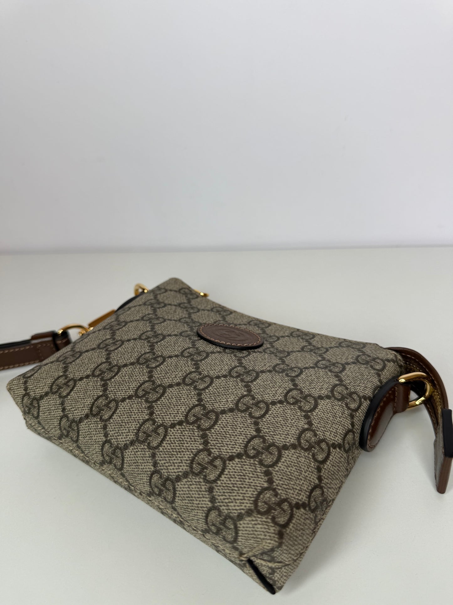 Gucci GG Coated Canvas Interlocking G Patch Wristlet Mini Messenger Bag
